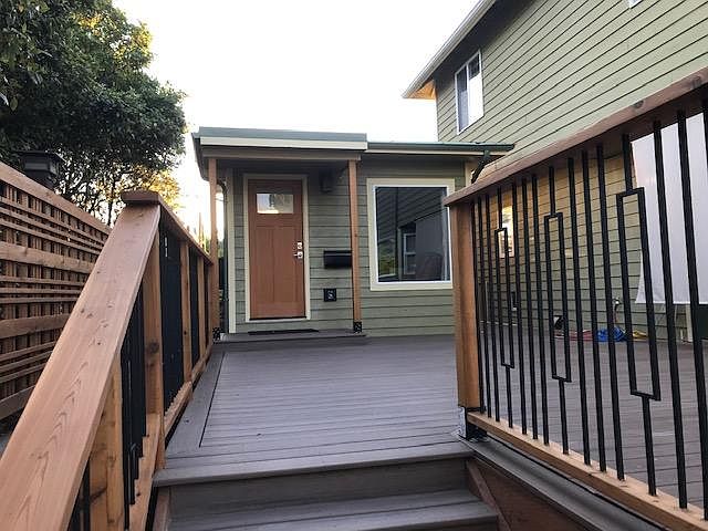 View of Studio Bungalow from steps to lower paver patio.