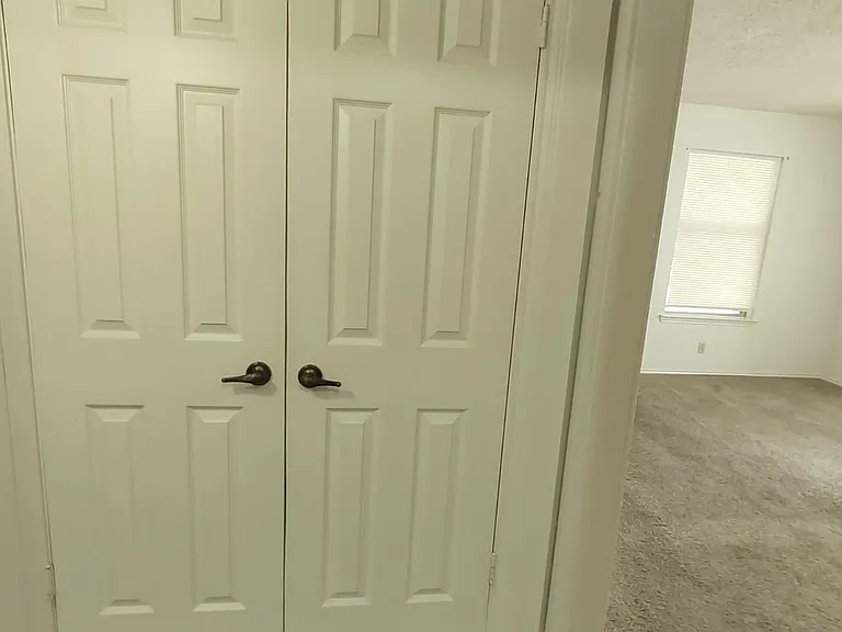 Hall closet in 2 bedroom apartment.