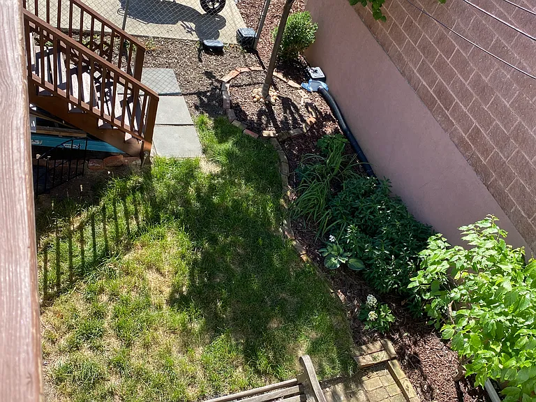 the view from your private deck to the garden and your private parking