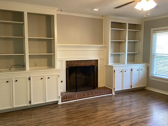 Living room with shelving and storage
