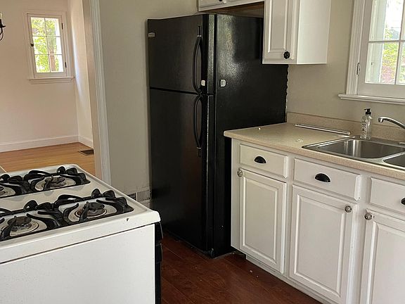 NICE SIZE GALLEY KITCHEN WITH MICROWAVE - DISHWASHER - NEW GAS RANGE - REFIGERATOR