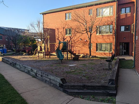 Playground right next to apartment building.
