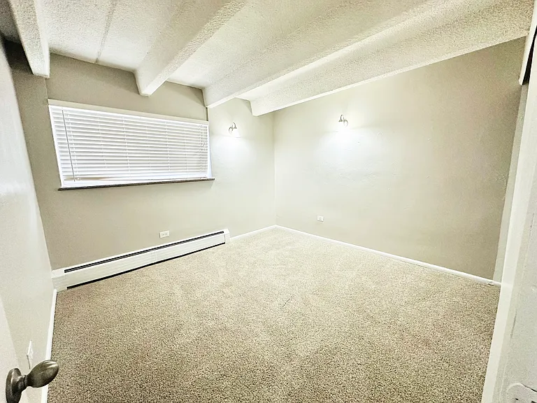 Experience comfort in this cozy, well-lit bedroom with contemporary design. Experience comfort in this cozy, well-lit bedroom with contemporary design.