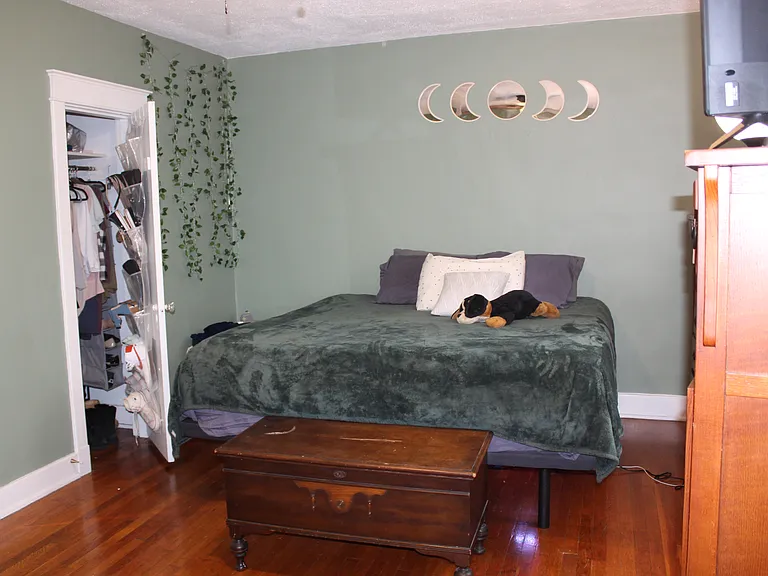 Primary Bedroom After painting. Easily fits King sized bed.