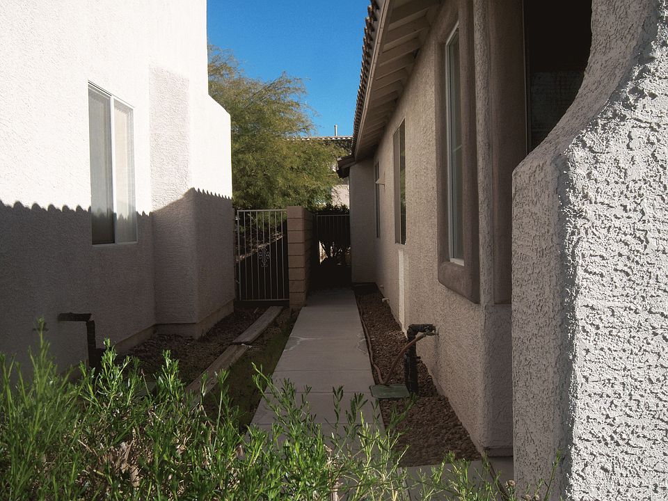 Sidewalk leading to covered patio