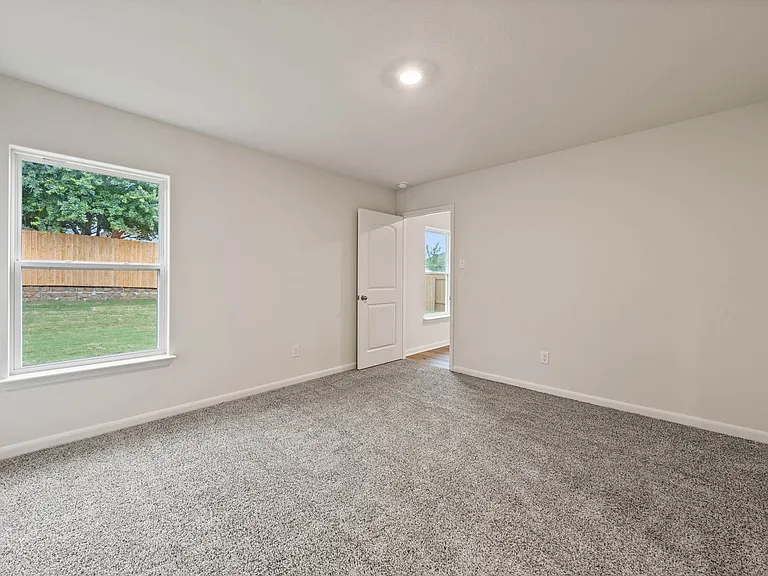 The master bedroom has two large windows that let in great, natural light.