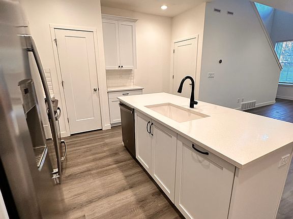 Kitchen
(L-R) Door to pantry, Door to stairs down to unfinished basement