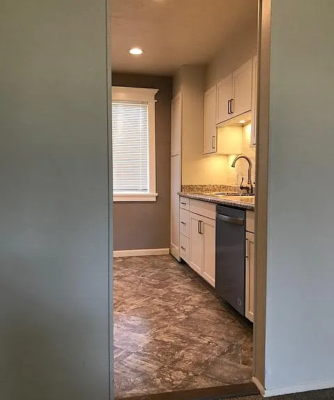 Kitchen entrance with the countertop lighted.