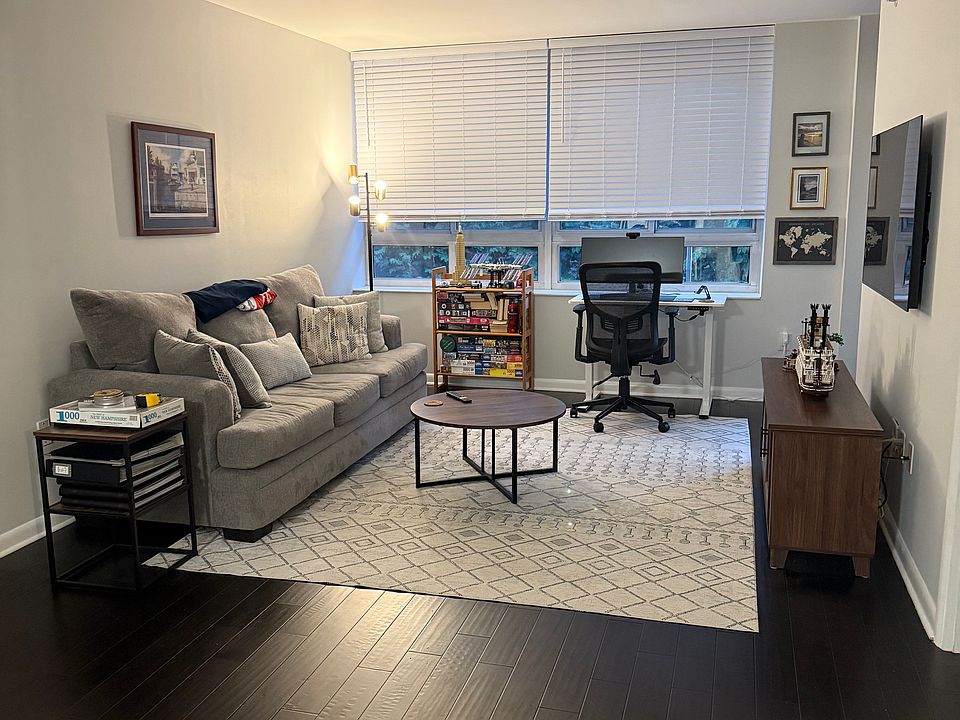 Living area featuring large window and TV mount.