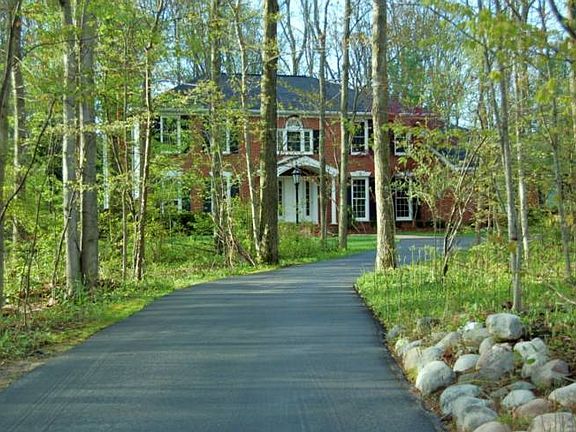 Beautiful, enchanting setting with a circular drive and many trees to give you the privacy that you want.