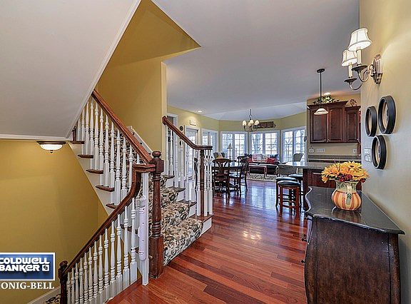 Welcome Guests in this Open Foyer with Custom Turned Staircase to the Finished Lower Level.