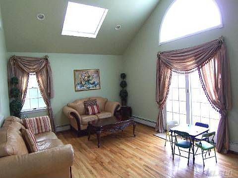 Den with cathedral ceiling & 2 skylights