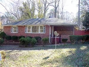 All brick ranch on double lot with fenced yard