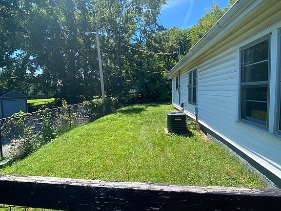 Fenced side and back yards