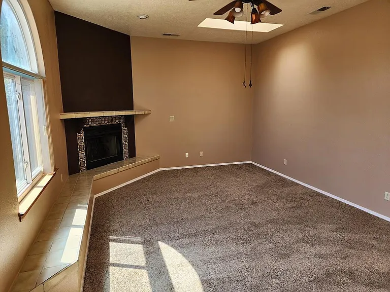 First Floor - Living room. Newly carpeted and painted.