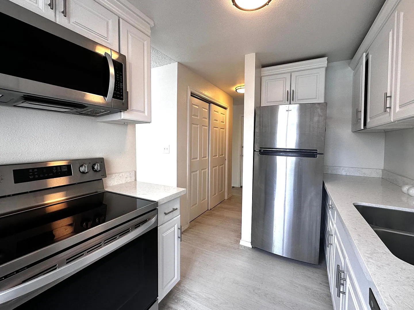 Updated 2-Bedroom Condo with Water Views, 2 Parking Spaces & Poolside Location — Photo 4