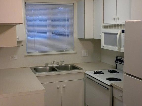 Full sizes stove & refrigerator, M/W above the range.