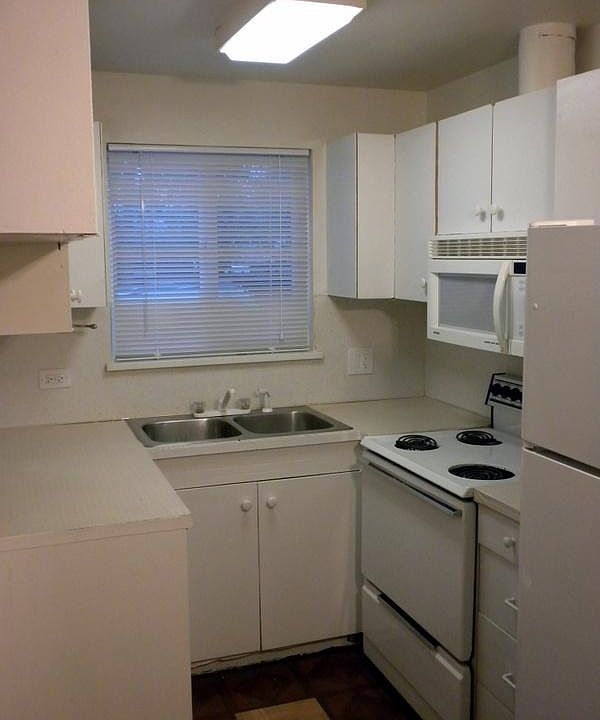 Full sizes stove & refrigerator, M/W above the range.