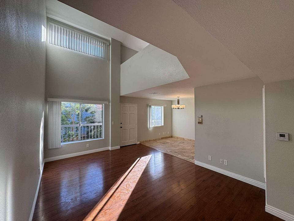 Beautiful open space. Lots of natural light and airy. Cathedral ceilings. Natural stone travertine in the dining and kitchen area with wood floors throughout