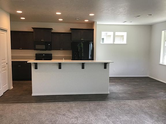 Quartz countertops and plenty of storage in the pantry
