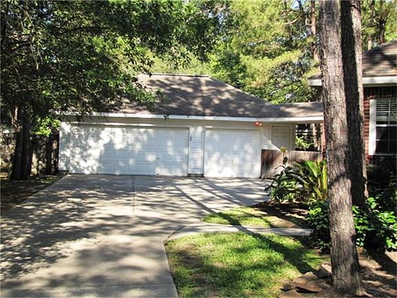 Oversized 3 car garage with a workbench.