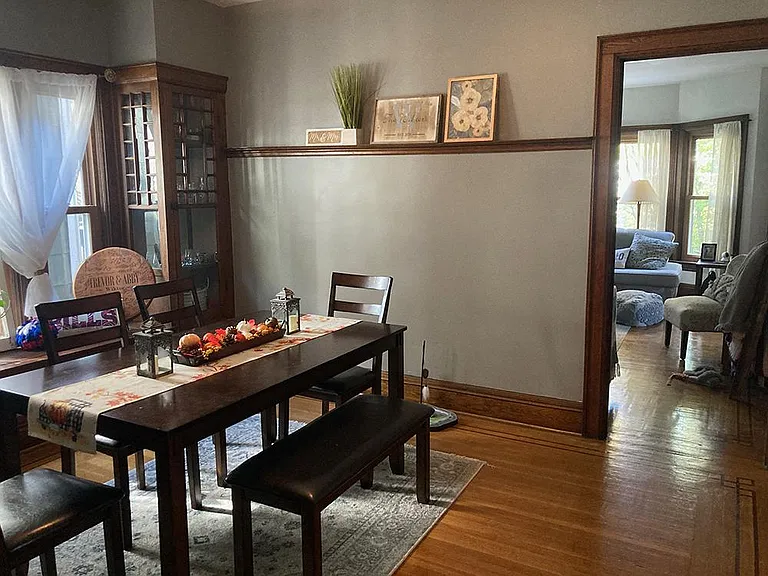 dining room looking forward, built in corner cabinets and window seat