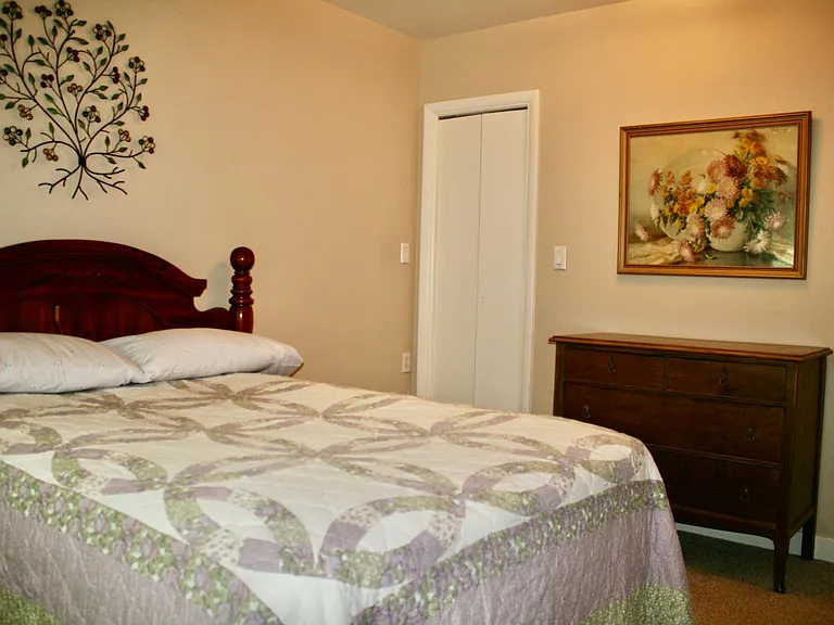 Bedroom full bed and closet.