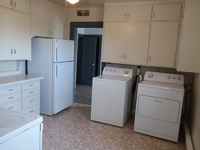 Kitchen, with in unit washer and dryer