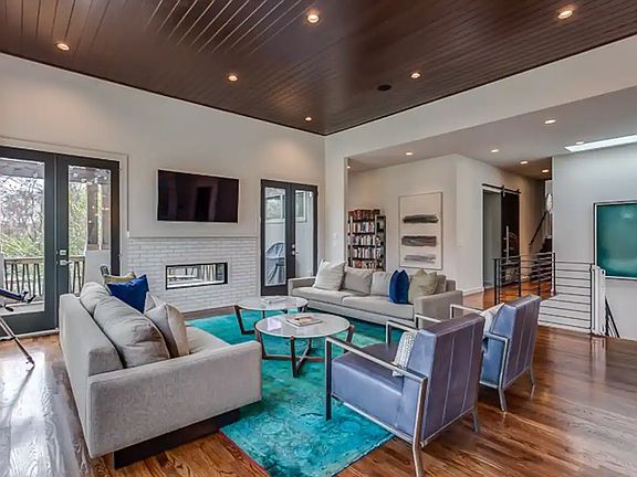 Living room with view of the doors that lead out to the upper deck.