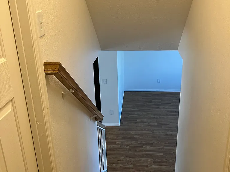 View from top of stair showing handrail