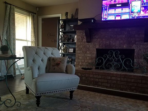 Fireplace in den.