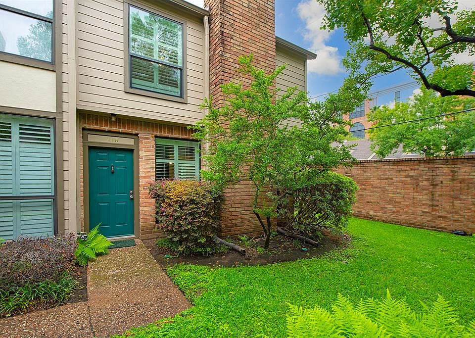 Spacious corner unit with private green space.