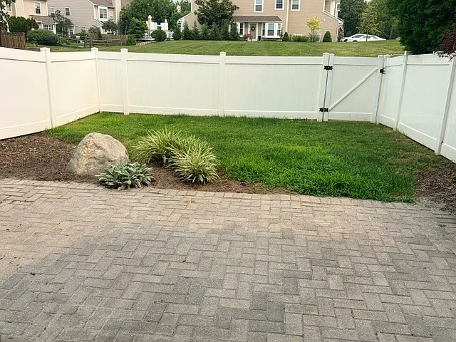 Fenced backyard with patio