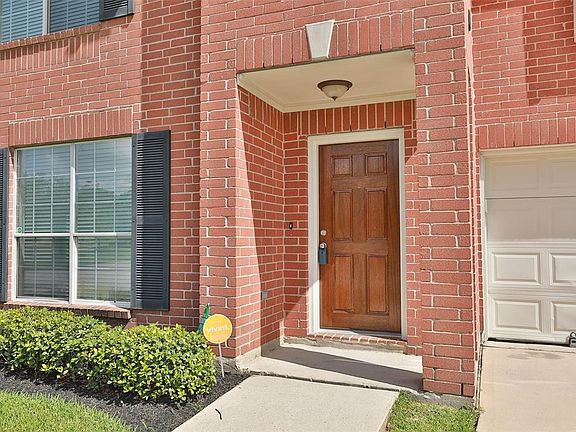 Recently refinished solid wood entry door. Covered front porch. Low maintenance front yard.