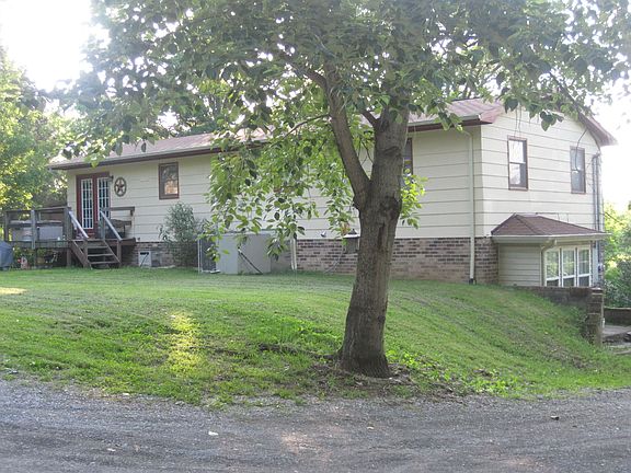 Home from back view large gravel drive