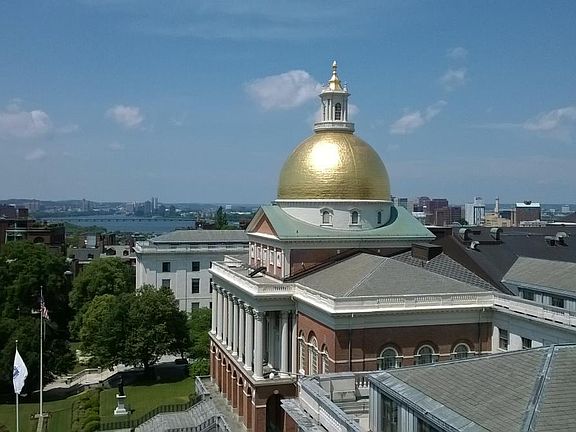 Roof deck view of State House, Charles River