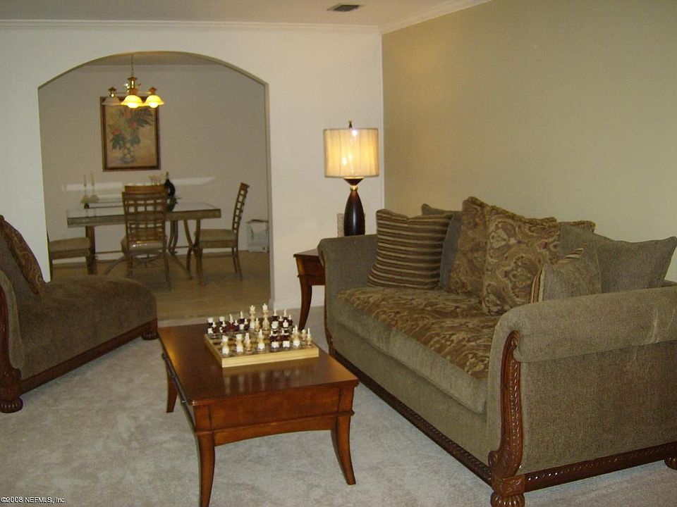 Formal living and dining rooms with new carpet and designer paint