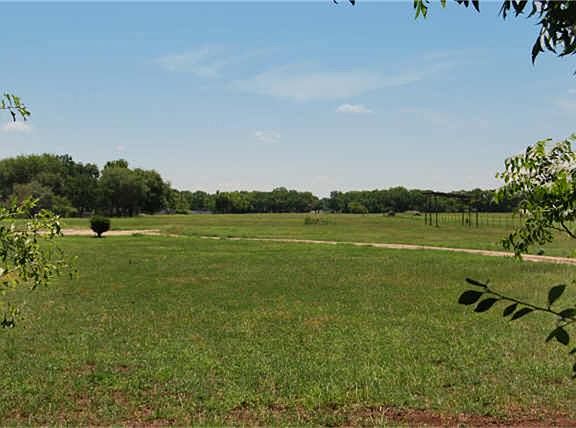 Depth of the lot is 2,099 feet.  That's "7" football fields.