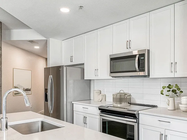 Our newly renovated kitchen feature shaker cabinets in either white or gray