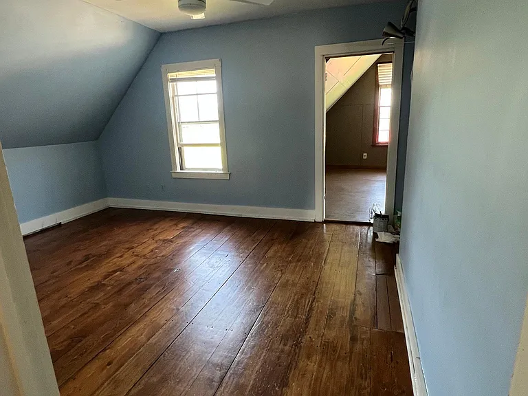 Master bedroom with door to bonus room