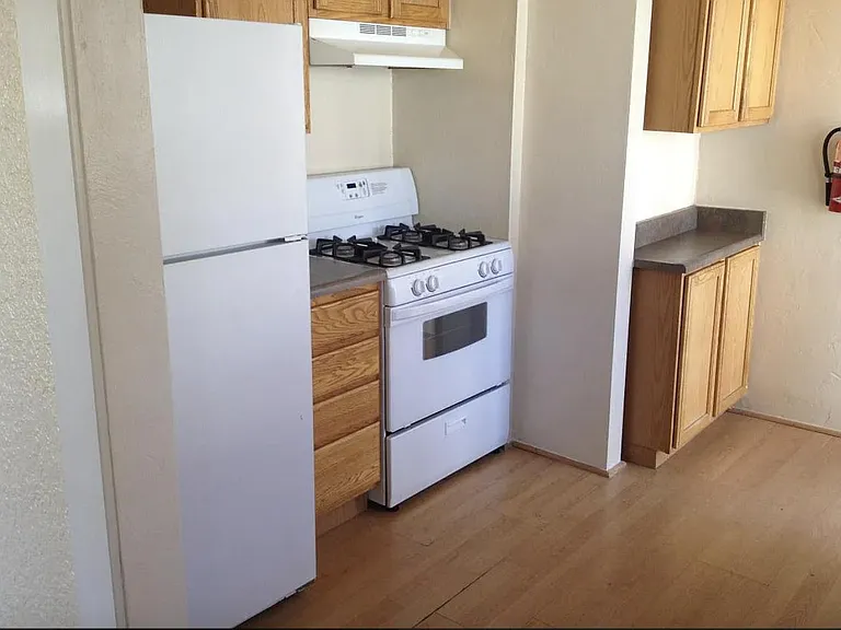 Gas stove and small pantry.