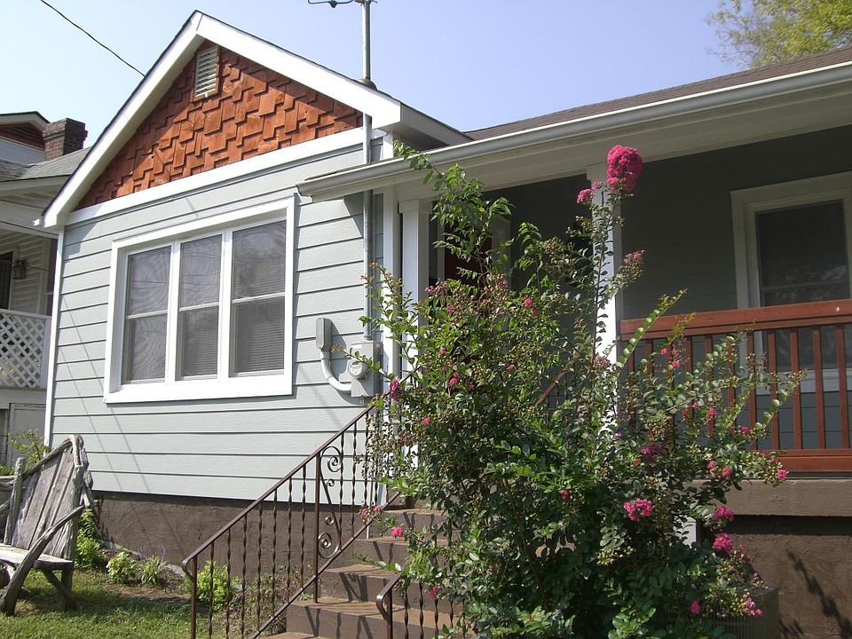 Cute cottage with covered front porch.