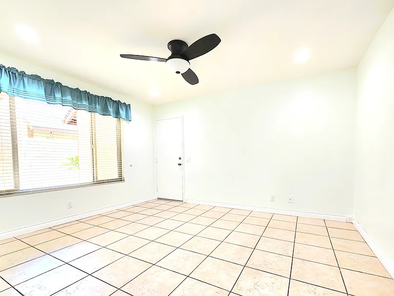Living Room / Access Attached 2 Car Garage