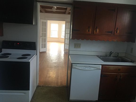Kitchen with view through Dining Room and Living Room