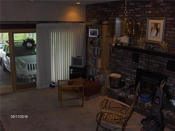 Sunken family room with fireplace.