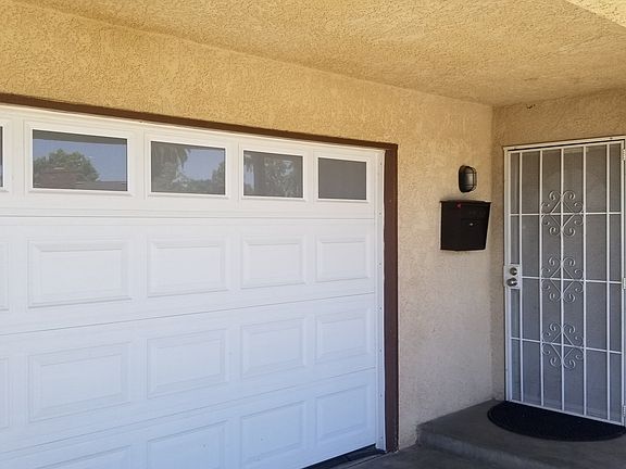 Front Porch with oversized lockable mailbox and security screen door.