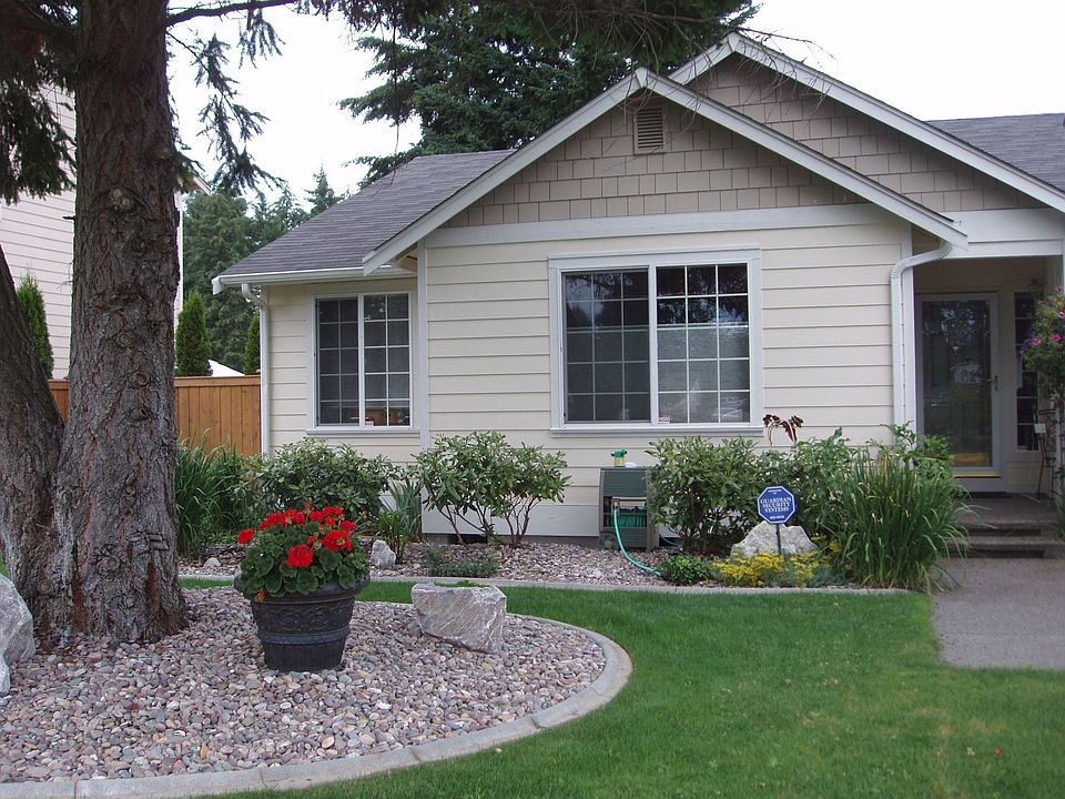Neatly curbed landscaped with sprinkler system