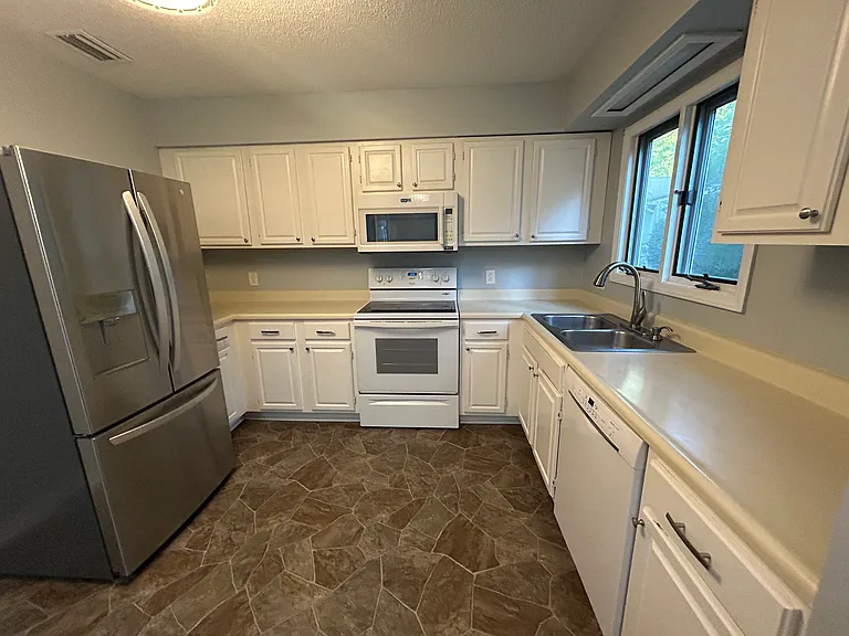 Kitchen, new refrigerator, other appliances all in good working order.