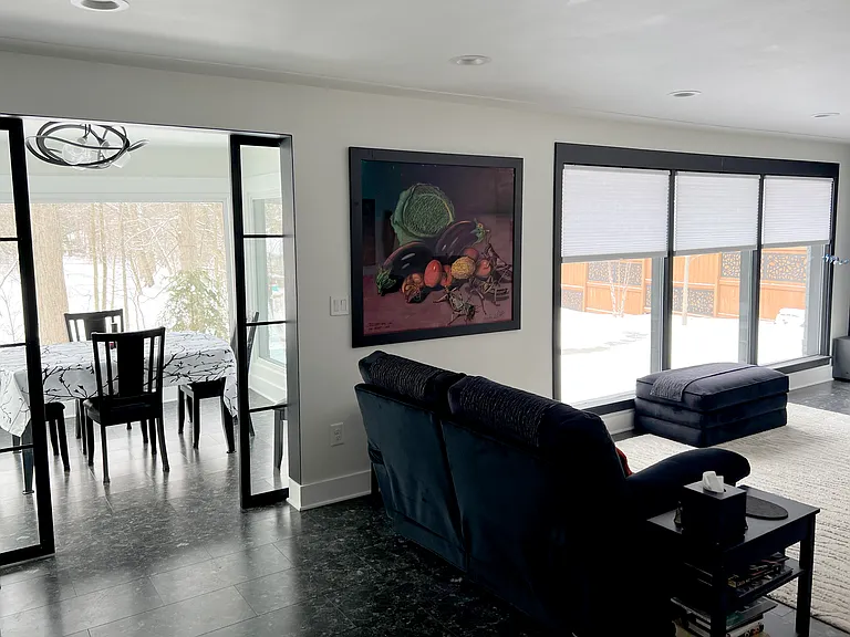 living room and dining room windows with winter landscape