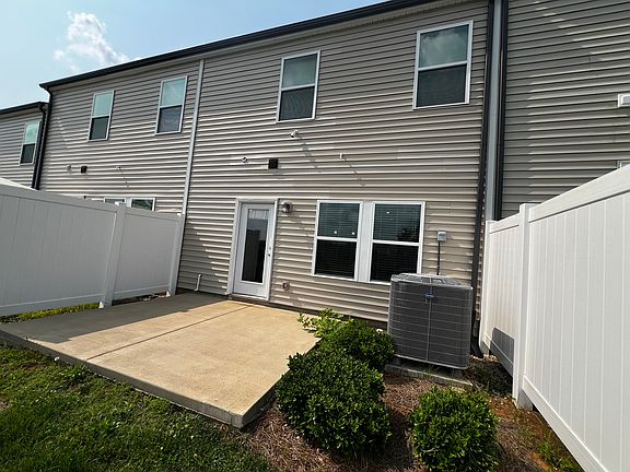 Back of home with deck